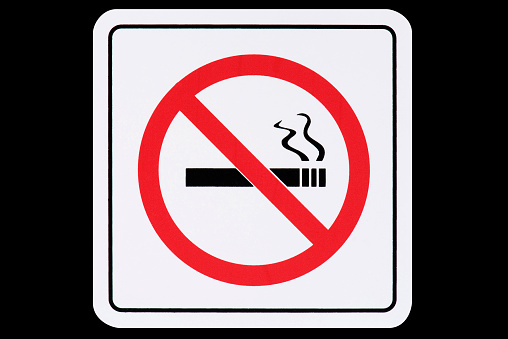 No smoking sign on black background.