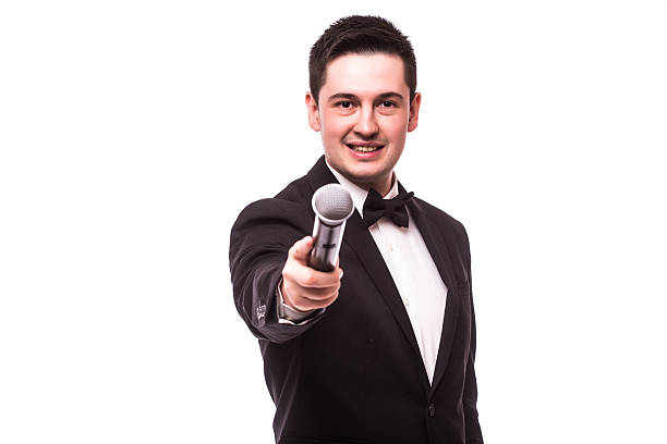 istock The Showman  interviewer. Young elegant man holding microphone.Showman concept. 510409206