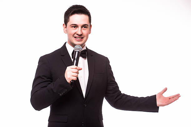 istock Showman talking holding microphone and present invisible product.Showman concept. 510409272
