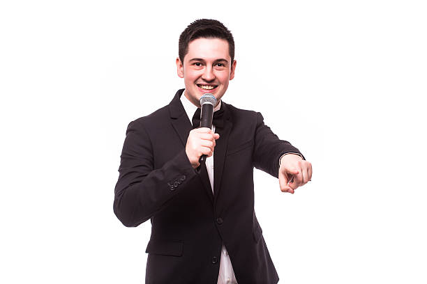 istock Showman talking holding microphone and present invisible product.Showman concept. 510409334