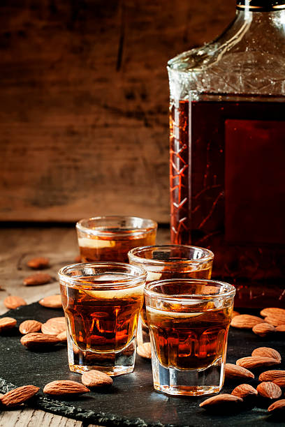 istock Cold whiskey with ice in a glass and snack almonds 510409914
