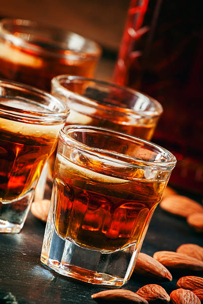 istock Cold whiskey with ice in a glass and snack almonds 510409994