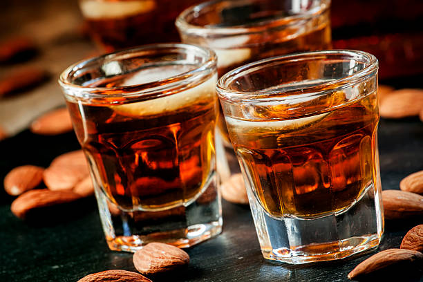 istock Cold whiskey with ice in a glass and snack almonds 510410050