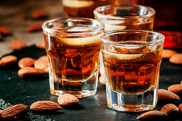 istock Cold whiskey with ice in a glass and snack almonds 510410130