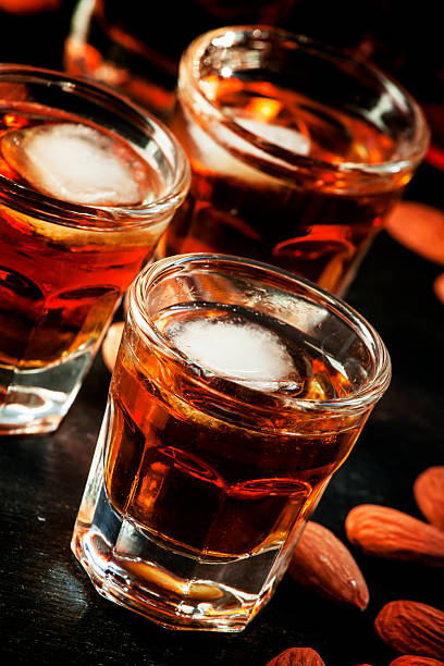 istock Cold whiskey with ice in a glass and snack almonds 510410208