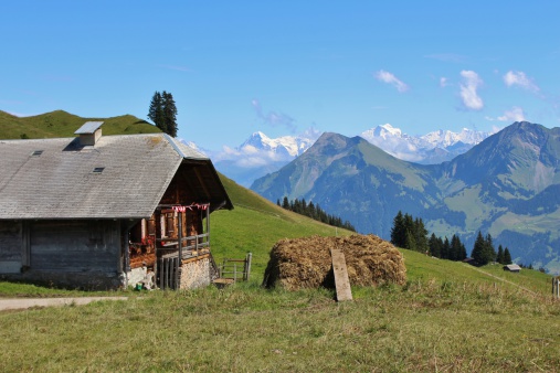 Farm and view of the Niesen, scene in the Bernese Oberland.