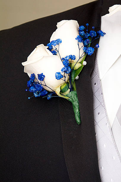 istock white roses boutonniere 510412614