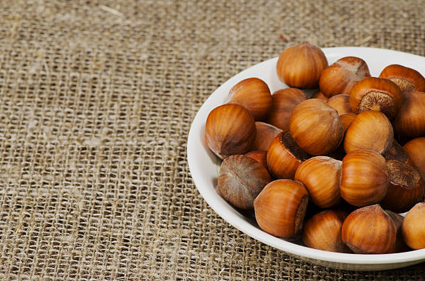 istock pile of hazelnuts in shell on wooden table 510412832