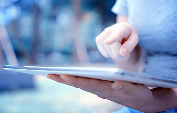 istock Female holding tablet 510412999