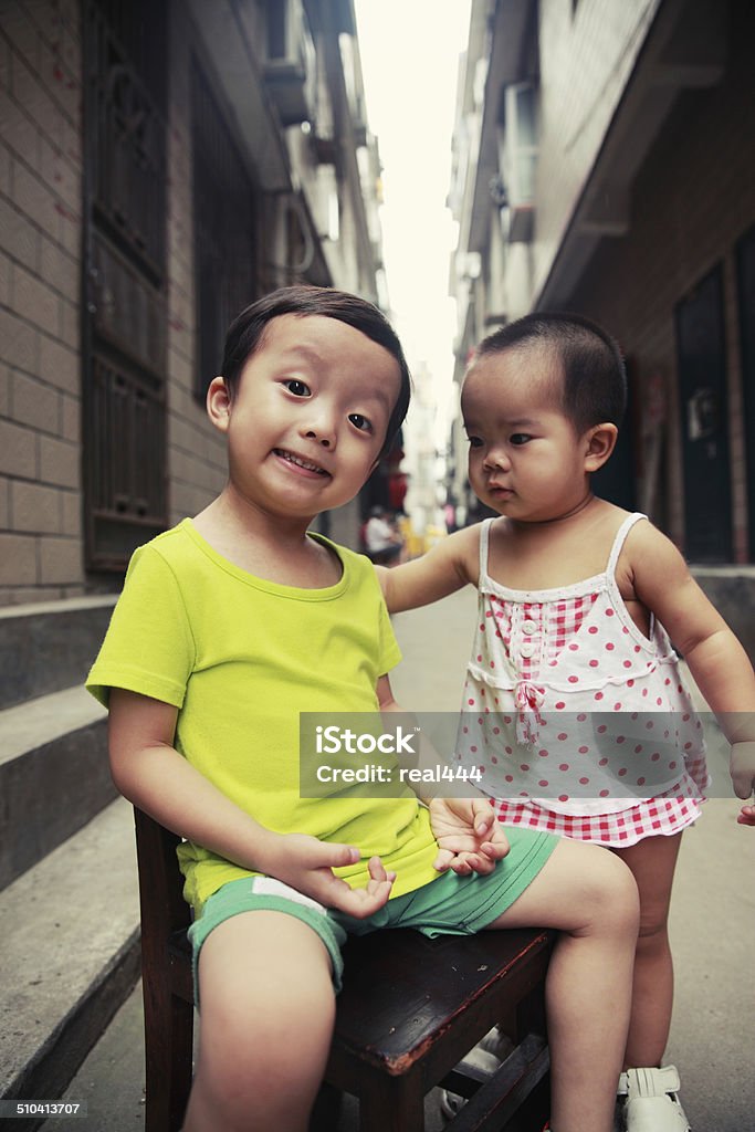 Cute asia children in the hutong 12-23 Months Stock Photo