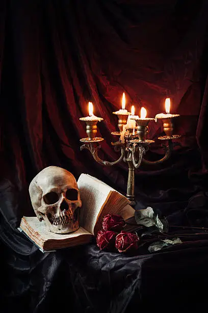 Photo of Still life with skull, book and candlestick