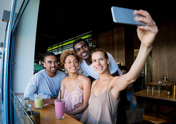 istock Friends taking a selfie at a cafe 510413922