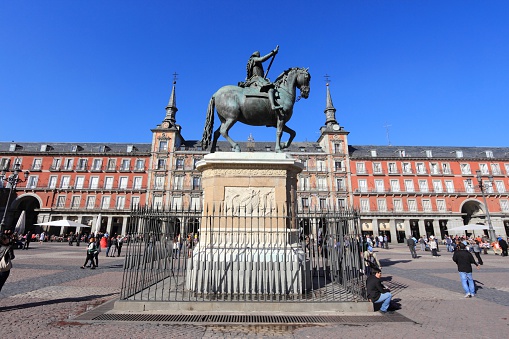 Madrid, Spain - October 22, 2012: People visit Plaza Mayor square on October 22, 2012 in Madrid. Madrid is a popular tourism destinations with 3.9 million estimated annual visitors (official data).