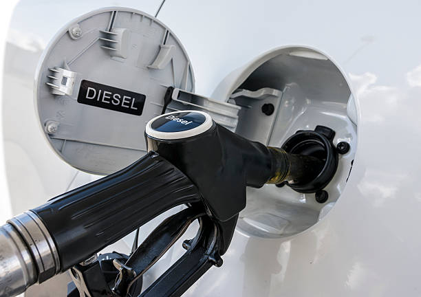 Refueling the car with diesel close up illustration.