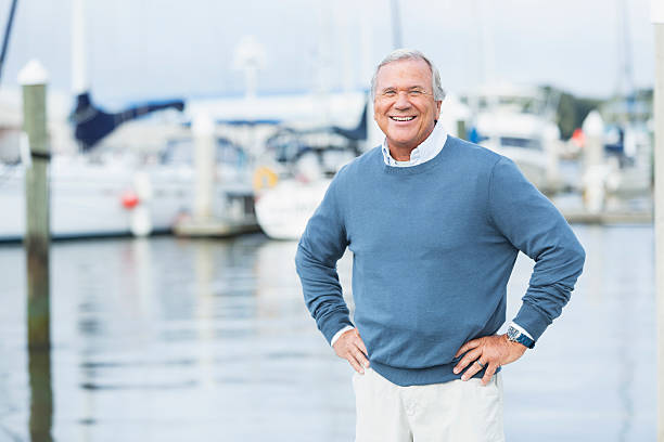 istock Senior man at marina, standing with hands on hips 510414266