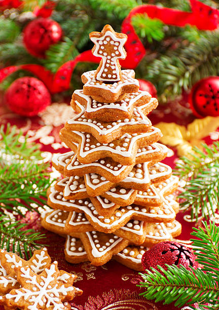 Tree of ginger cookies on a festive table.