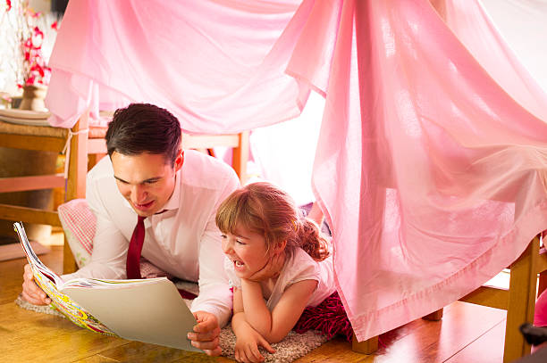 istock father and daughter storytime 510418721