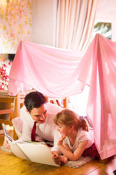 istock father and daughter storytime 510418755