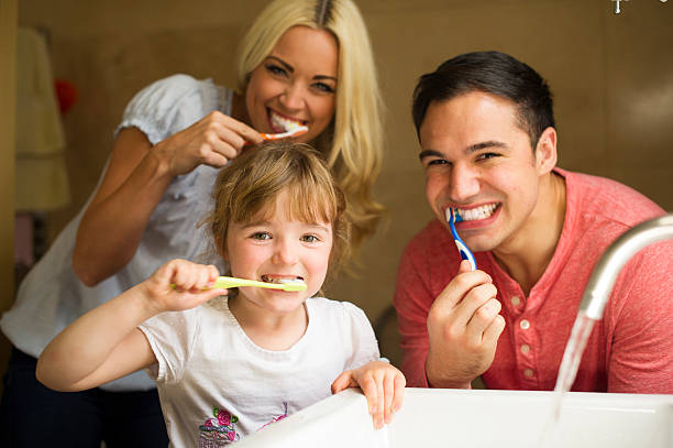 istock family teeth brushing 510418777