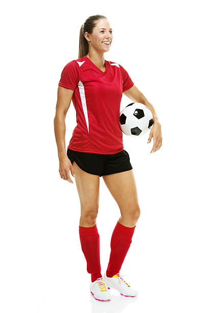 istock Cheerful soccer player standing & holding ball 510418893