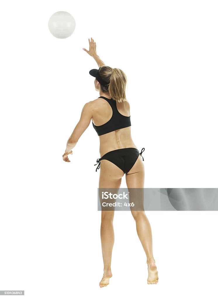 Woman playing beach volleyball Woman playing beach volleyballhttp://www.twodozendesign.info/i/1.png Volleying Stock Photo