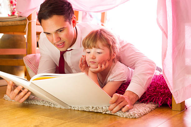 istock father and daughter storytime 510437053