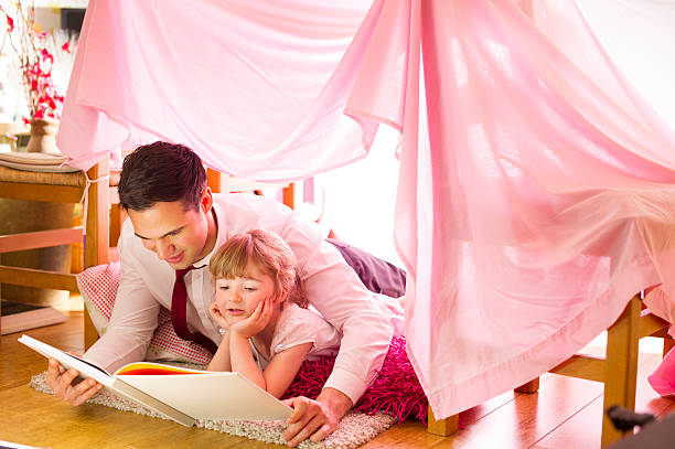 istock father and daughter storytime 510437055