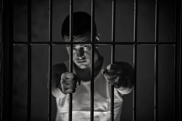 Desperate prisoner stock photo