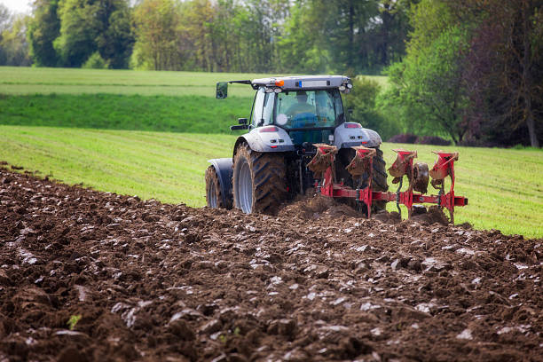 Tractor ploughing stock photo