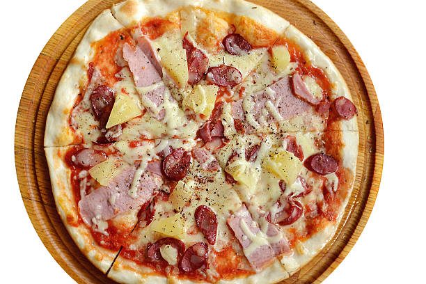 istock Round pizza with sausages and pineapple isolated on white 510440609