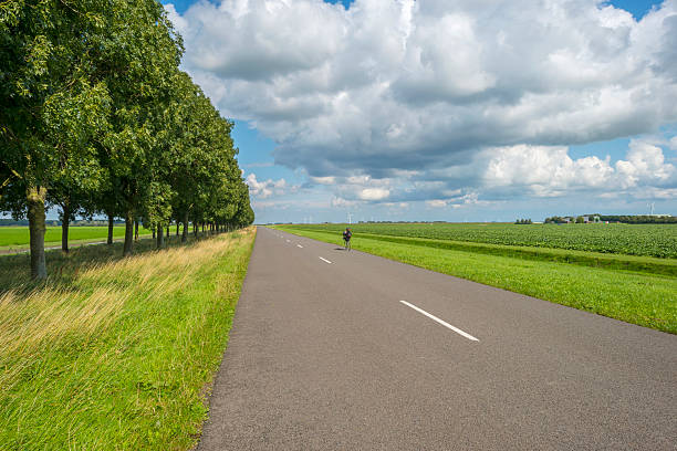 istock Clouds over a road through the countryside 510442409