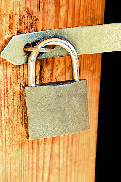 istock Old lock on a wooden door 510442461
