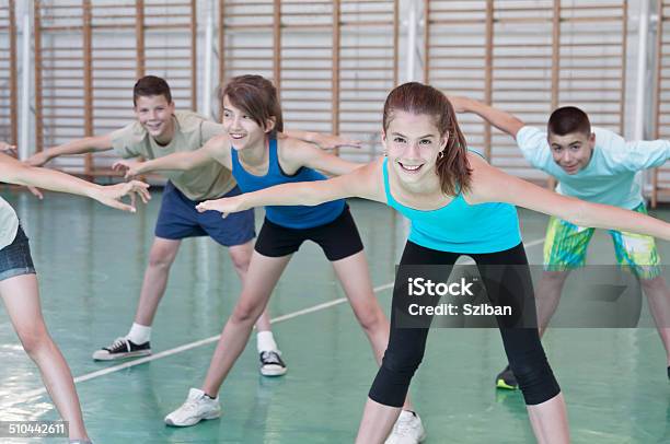 Teens In Gymnasium Stock Photo - Download Image Now - Teenager, Exercising, School Gymnasium