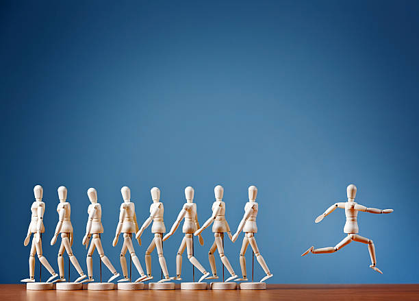 istock Odd man out rebels, breaking away from the crowd joyously 510444067