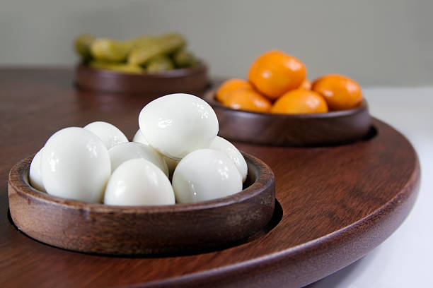 Bowls of boiled quail eggs and pickles Bowls of boiled quail eggs, smoked quail eggs and pickles quail egg stock pictures, royalty-free photos & images
