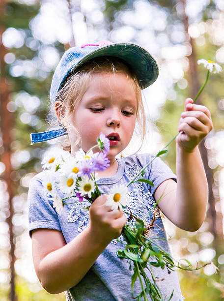 istock Girl picking flowers 510462045