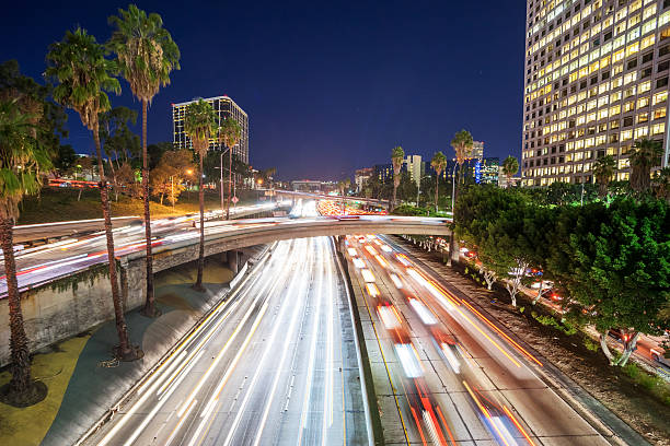 istock traffic through urban with sunset in los angle 510462116