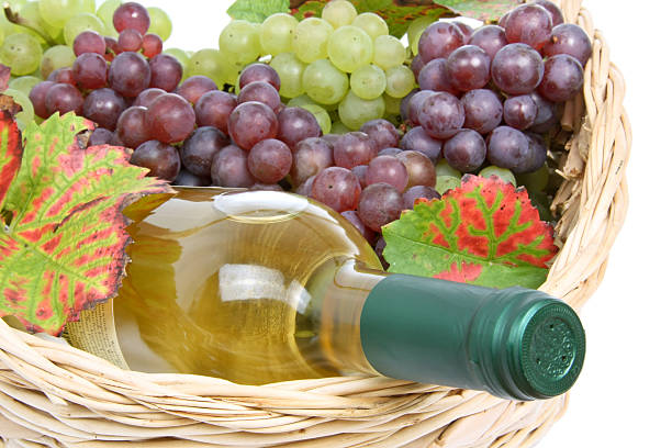 istock Basket with white wine and grapes 510462321