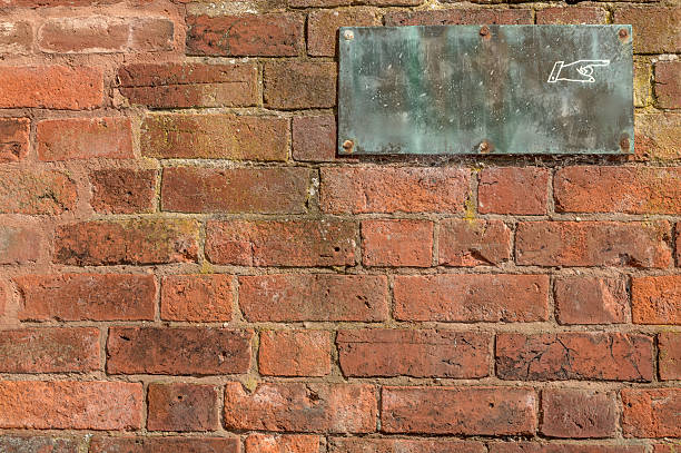 istock Blank old sign with copy space on brick wall 510462903