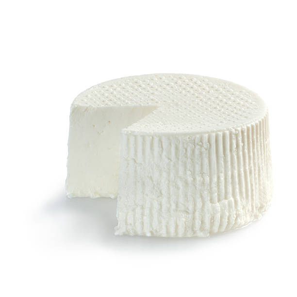 Ricotta cheese, just cutted on white background stock photo