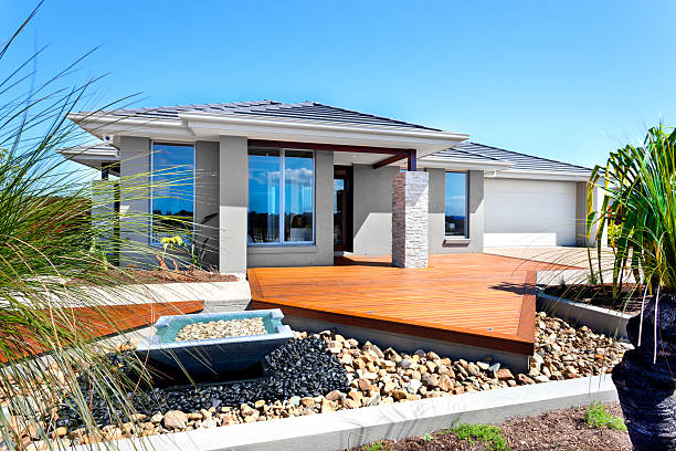 istock Modern house with trees and stone decoration 510464352