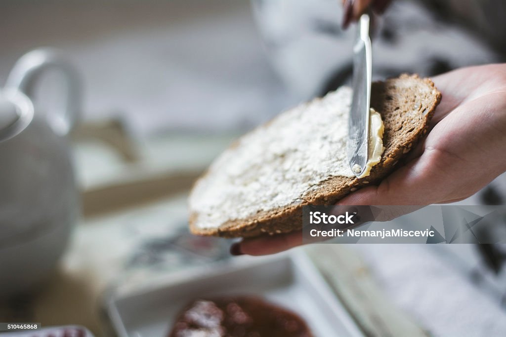 Butter on a slice of bread Butter on a slice of bread  Bread Stock Photo