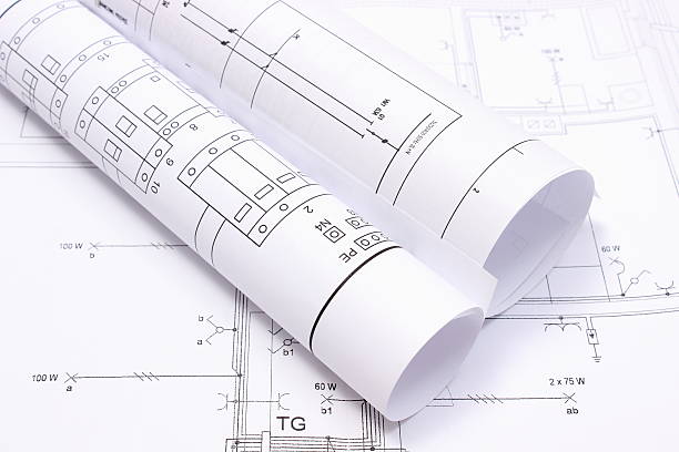 istock Rolled electrical diagrams on construction drawing of house 510466111