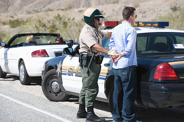 istock Police officer arresting driver 510466191