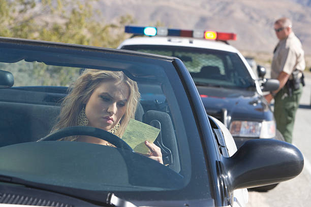 istock Young woman reading speeding ticket 510466195