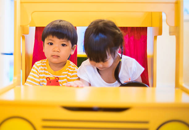 istock Asian Kid riding Toy car 510469116