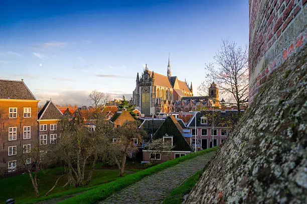 View to Hoodlandse Gothic Cathedral from Burcht van Leiden at evening low ungle light and blue sky