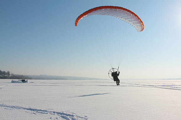 istock The flying-up person on a motorized paraglider 510469576
