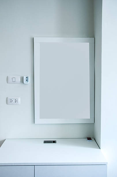 istock White wooden vanity table in white room 510471844