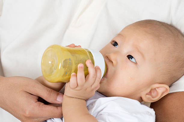 istock Father feeding baby 510473014